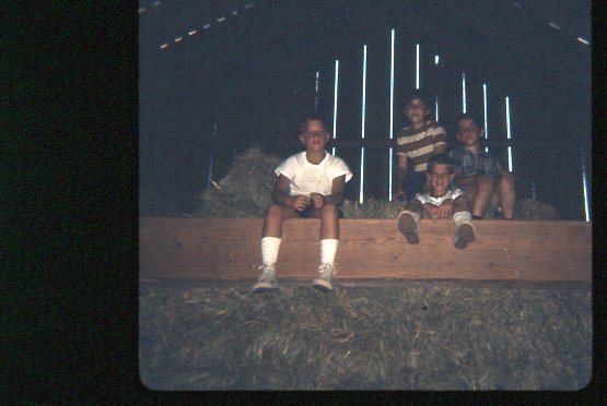 Sitting on a beam in the barn at Silver Lake House.